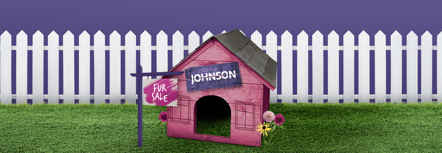 A pink dog house for Johnson the Newfoundland dog, with a sign that reads "FUR SALE"